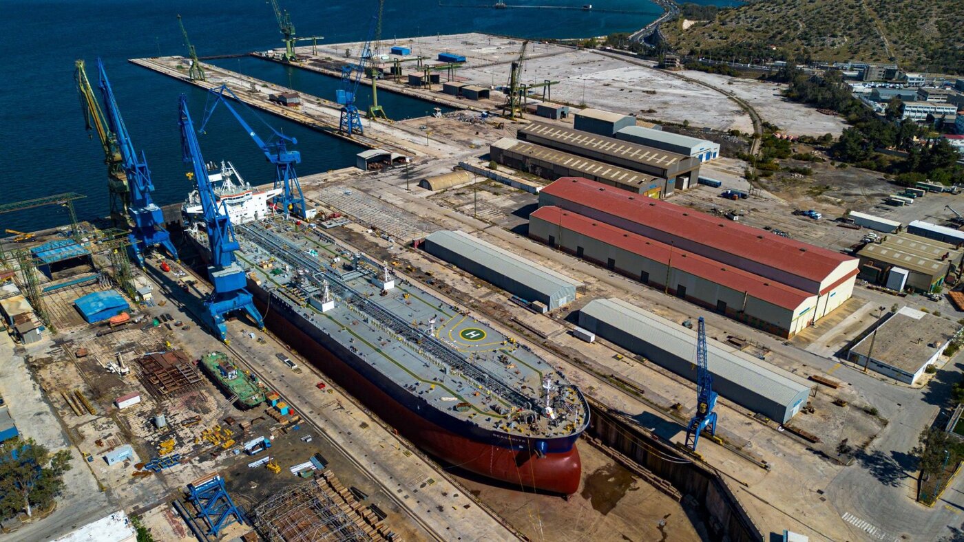 Aerial view of graving dock with vessel under repair at Greek shipyard