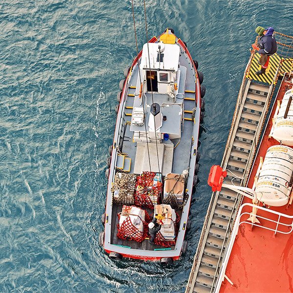 Launch boat delivering spares and stores to a vessel at Piraeus Anchorage
